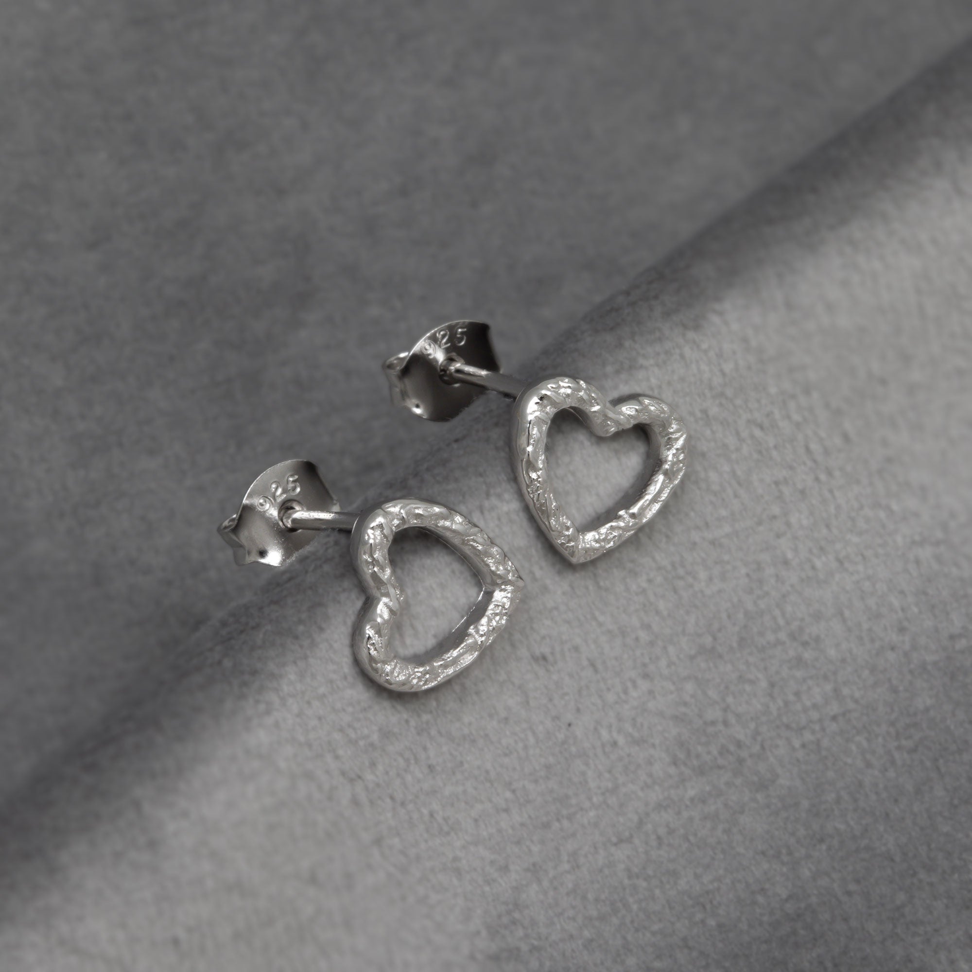 Textured heart-shaped textured silver earrings