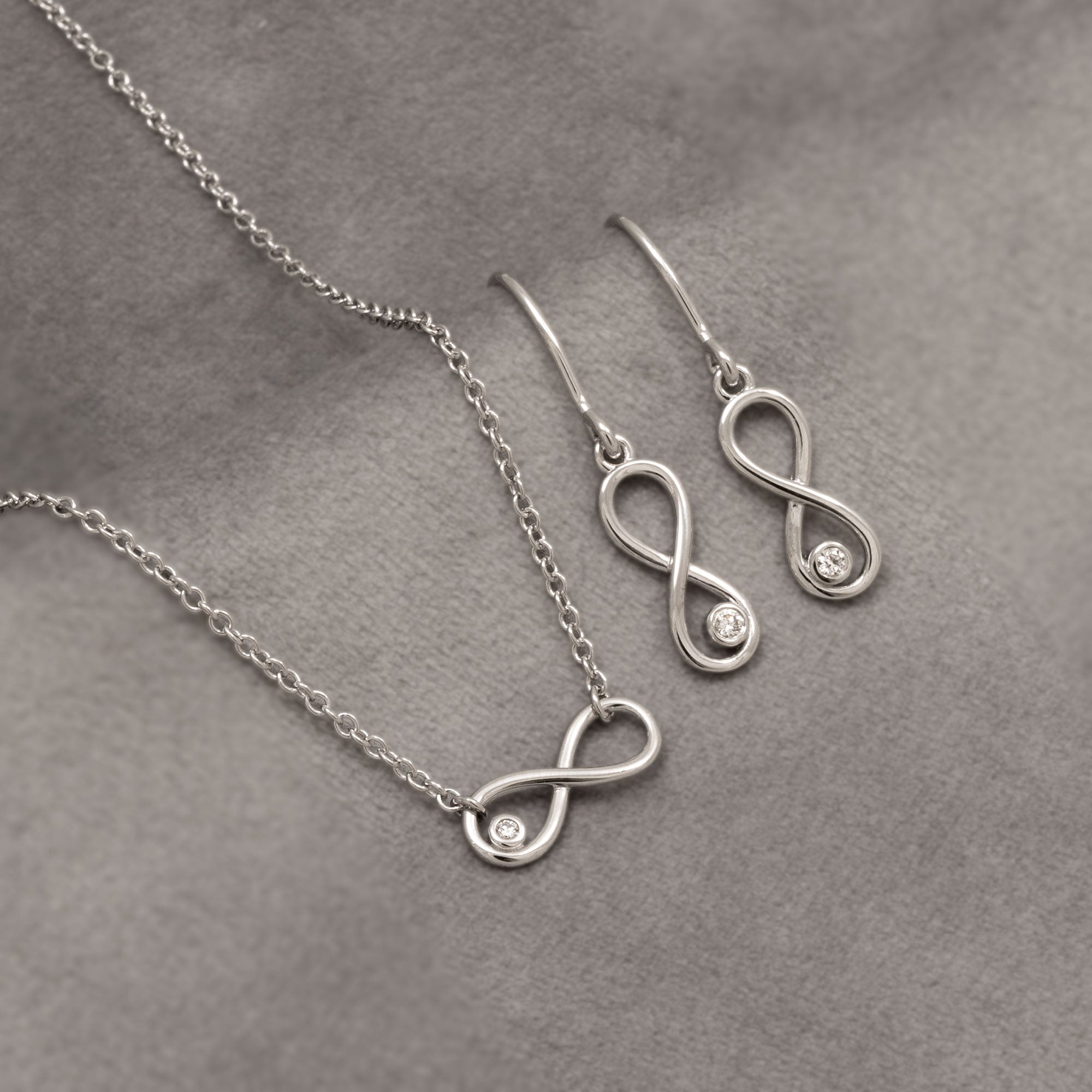Silver & Solitaire 0.10 Carat Lab Grown Diamond Infinity Drop Earrings