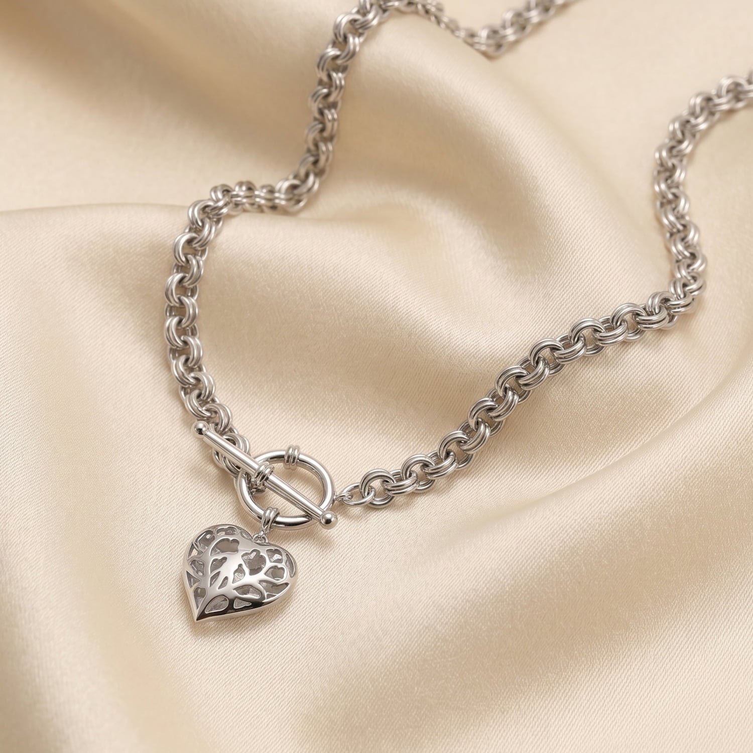 Sterling silver necklace with a sculptural chain and a hanging Yorkshire-inspired heart charm, featuring a T-bar clasp, showcasing expert British silver jewellery design.