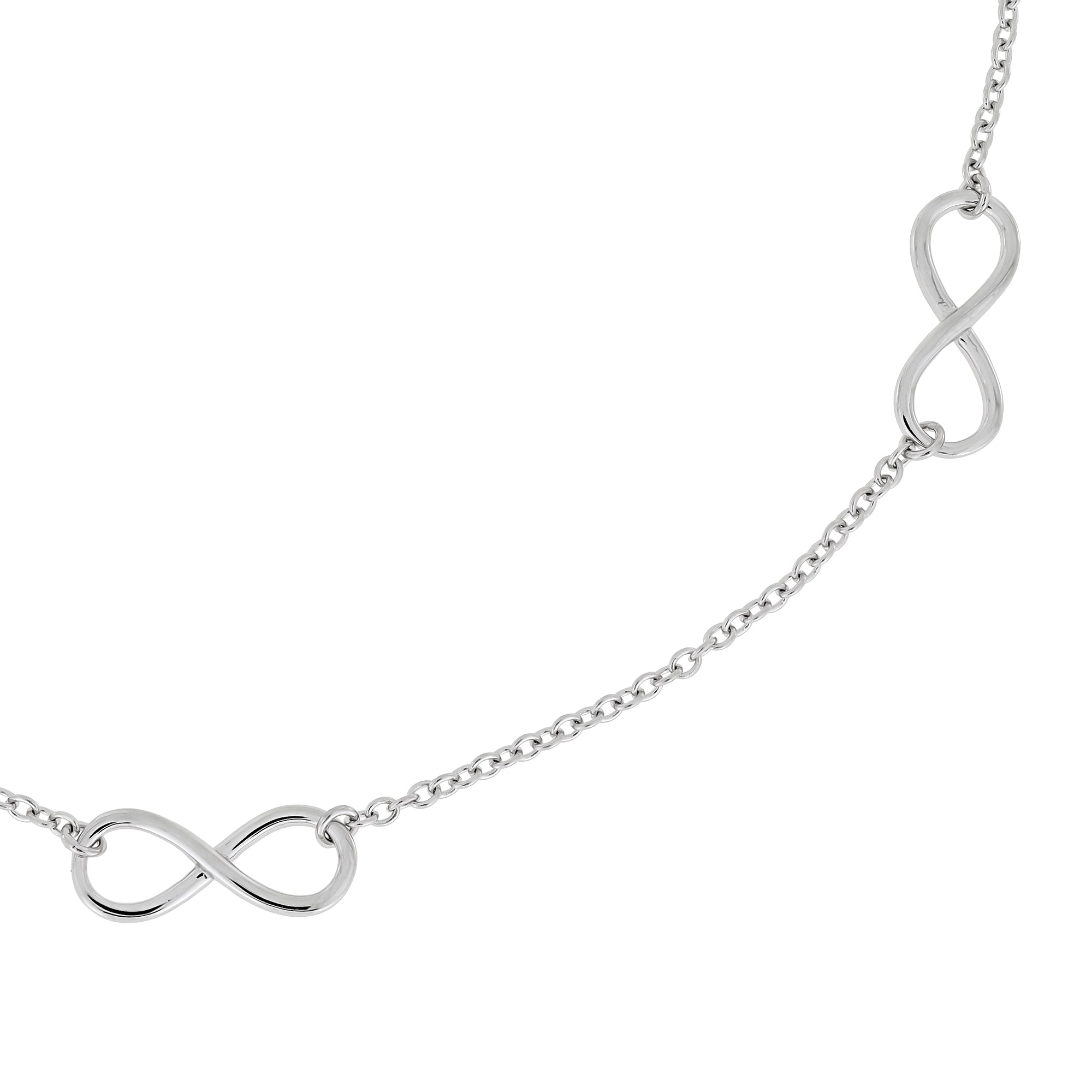 Close up od a delicate sterling silver necklace featuring multiple small infinity symbols spaced evenly along an adjustable chain, showcasing a minimalist and elegant design.