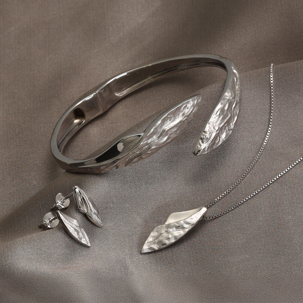 Malham Cove Curved Textured & Polished Stud Earrings