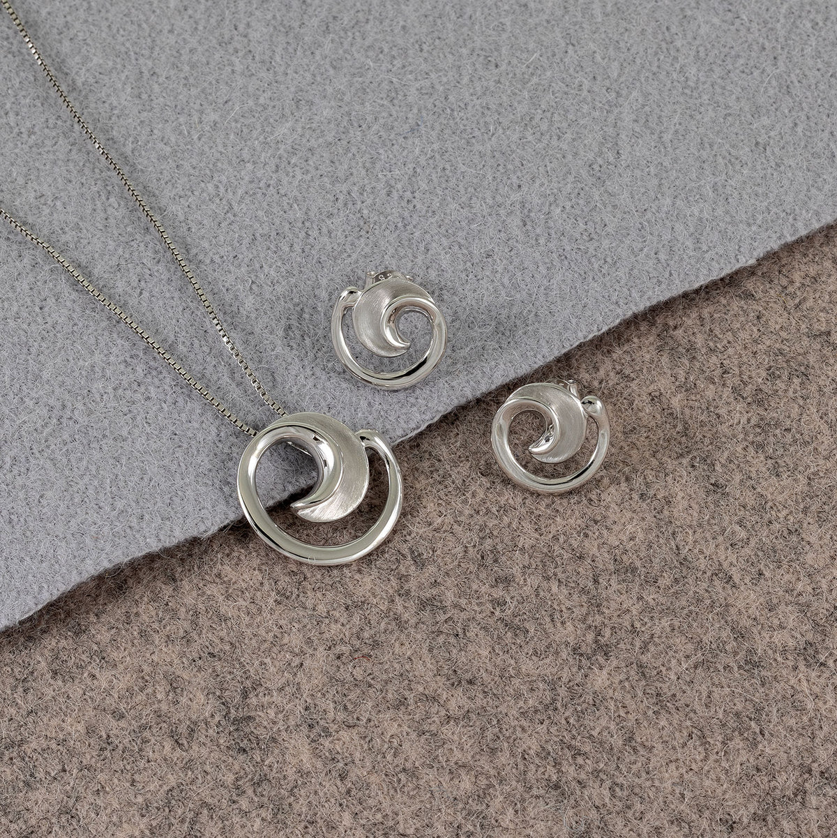 Silver Satin and Polished Curling Pendant