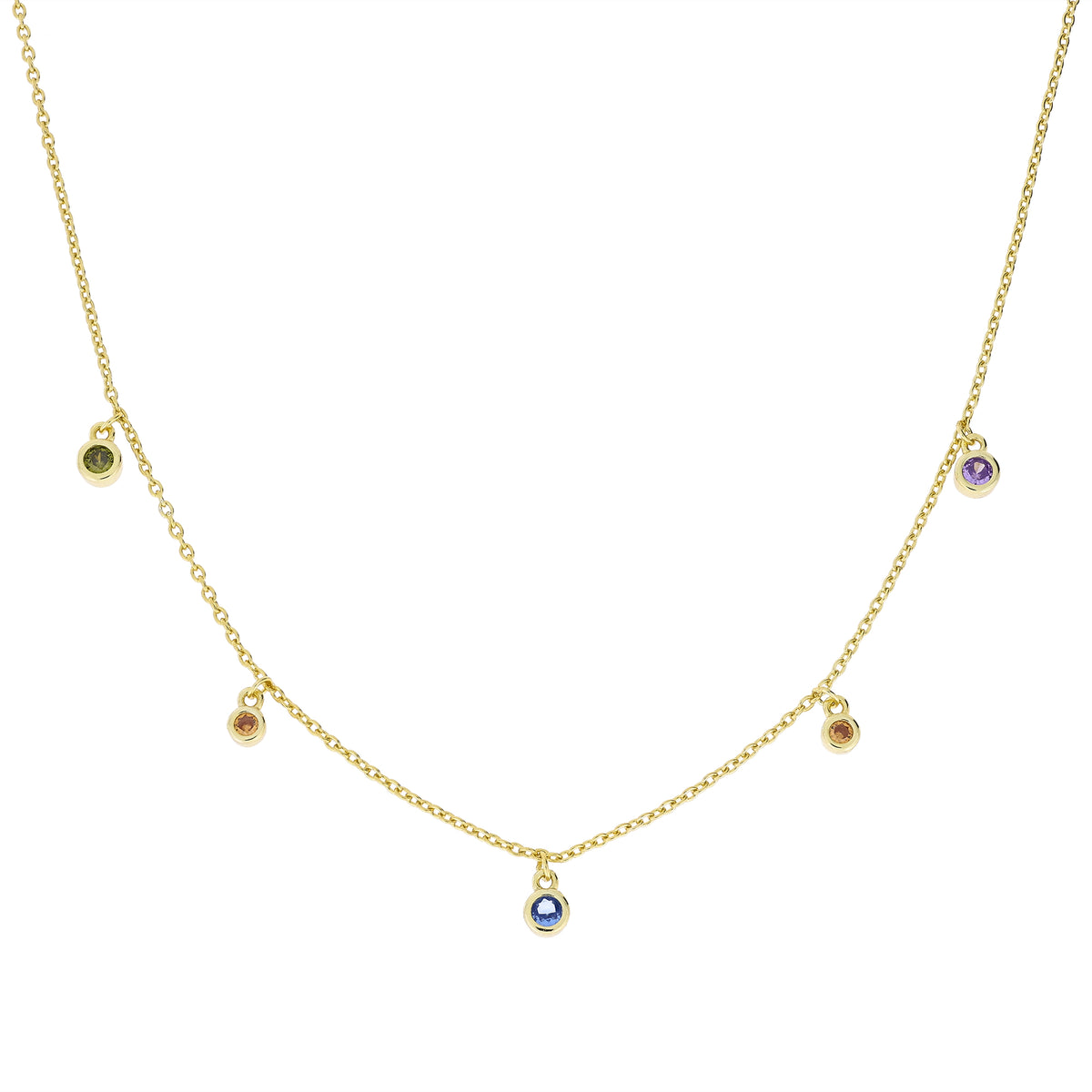 Delicate gold vermeil necklace featuring a fine chain with bezel-set colourful stones evenly spaced, reflecting a modern and sculptural approach to designer jewellery.