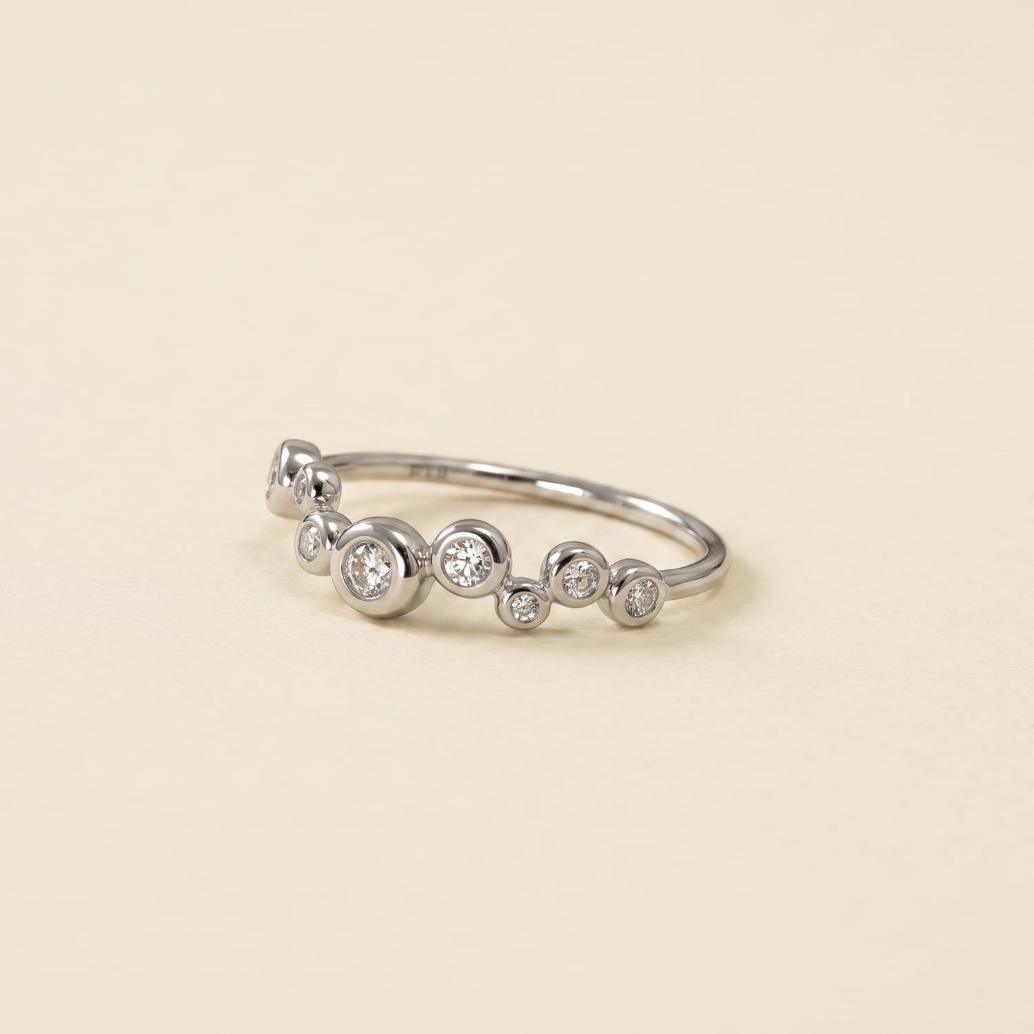 Delicate sterling silver ring featuring a cluster of sparkling cubic zirconia bubbles in varying sizes.