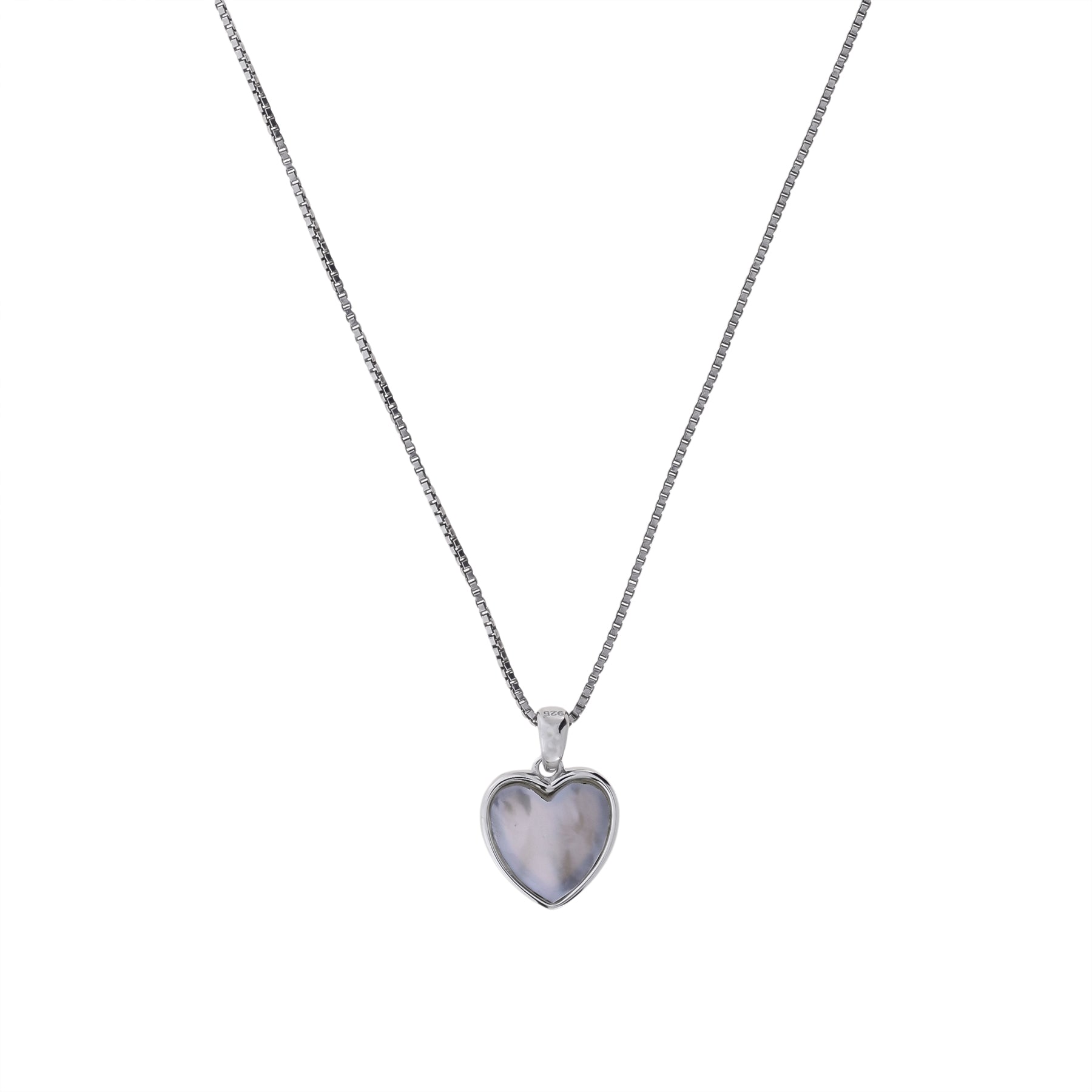 Delicate sterling silver necklace featuring a sculptural heart-shaped pendant set with white mother of pearl, showcasing refined design in contemporary silver jewellery.