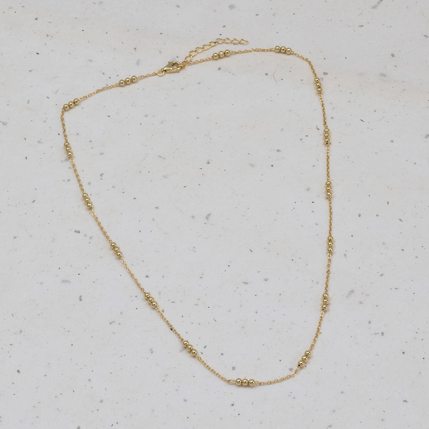 Triple Bead Chain Necklace - Gold Vermeil featuring delicate small gold beads evenly spaced along a fine chain with a 42cm length and 3cm extension for adjustable wear.