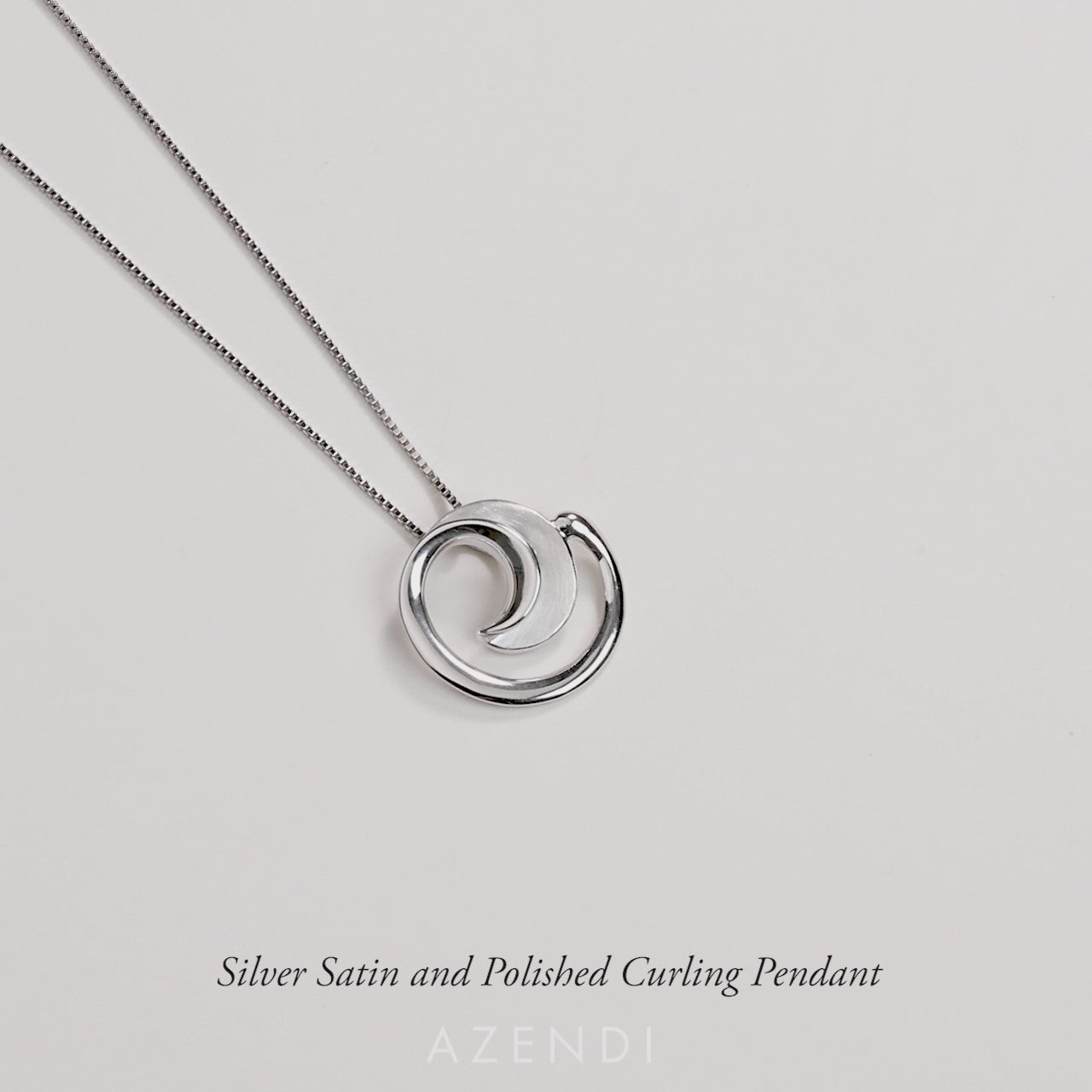 Silver Satin and Polished Curling Pendant