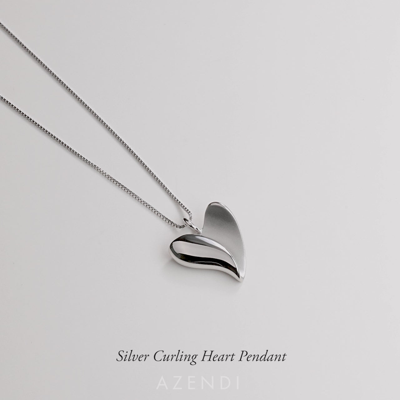 Silver Curling Heart Pendant