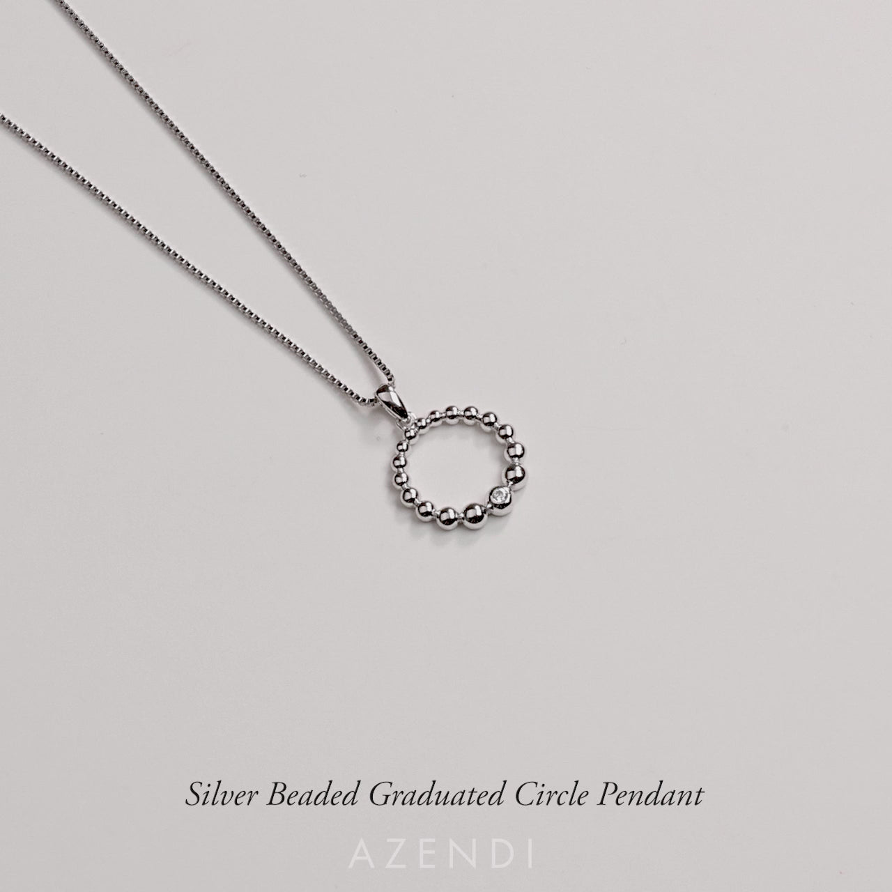 Silver Beaded Graduated Circle Pendant with Cubic Zirconia