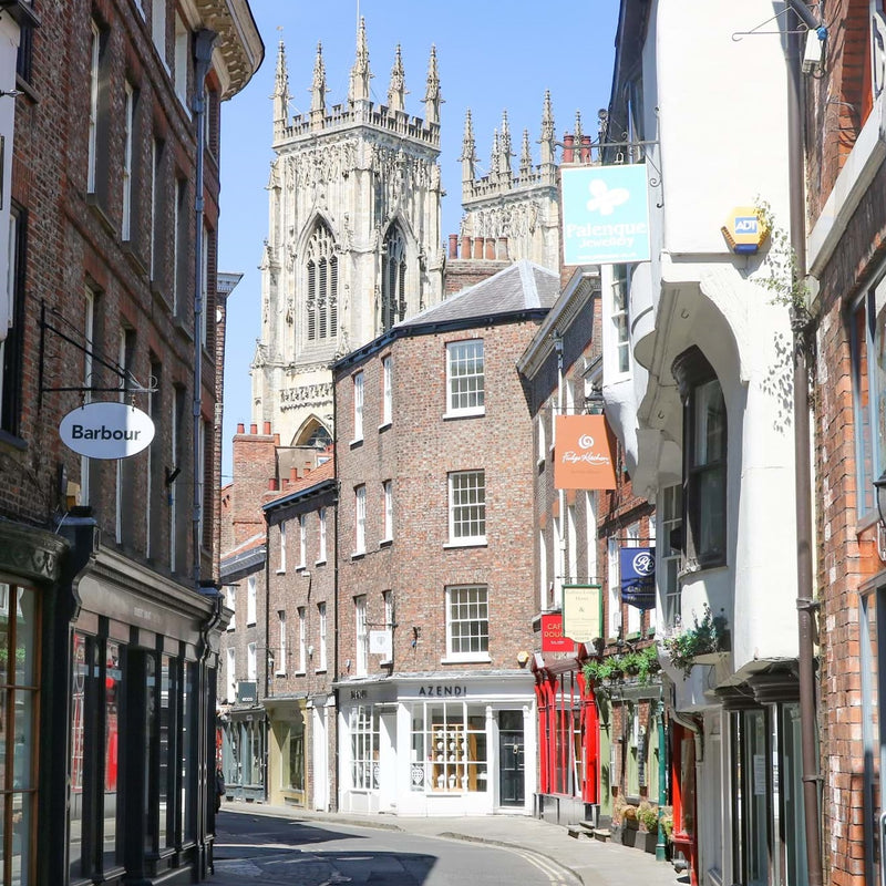 Looking up Low Petergate with the Azendi Jewellery store in the middle distance and York Minster in the far disatnce.