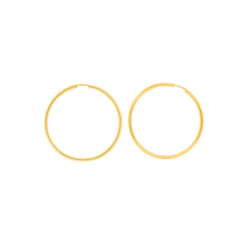 Pair of sleek gold vermeil hoop earrings with a classic flexible design, combining timeless elegance with contemporary British silver jewellery craftsmanship.