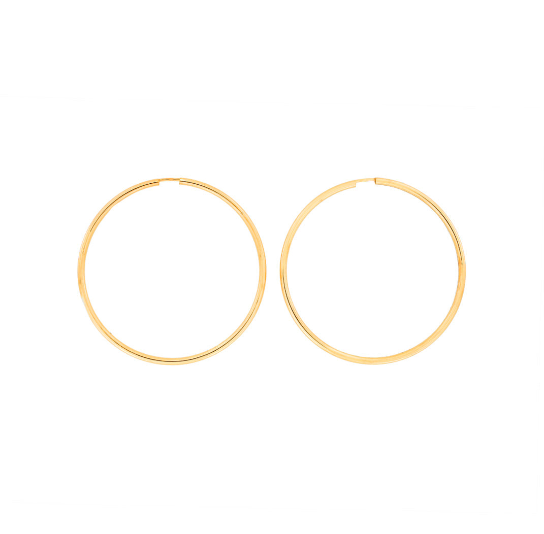 Pair of polished gold vermeil hoop earrings with a simple, classic 5cm diameter design, exemplifying timeless elegance in sterling silver jewellery by Azendi.