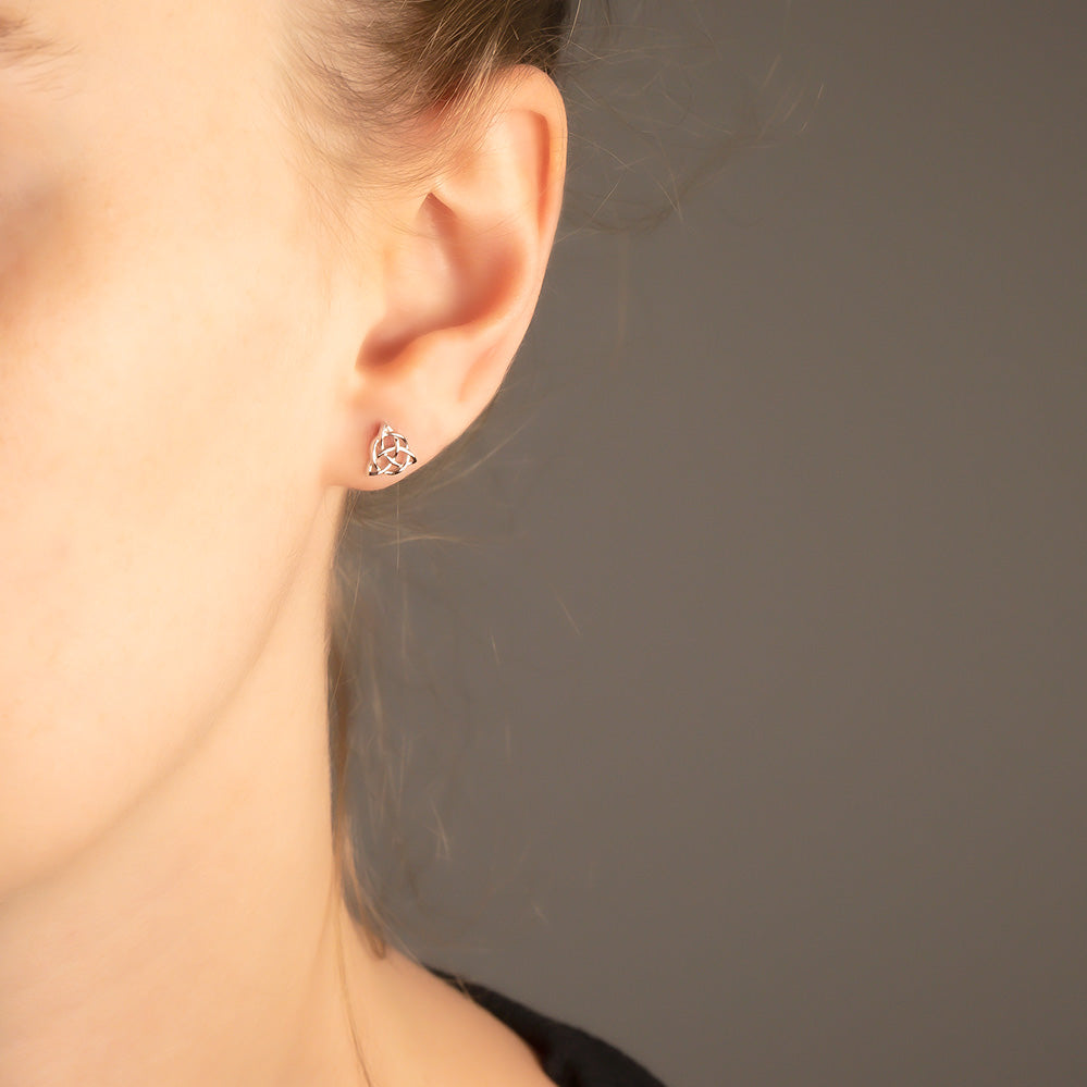 Delicate silver studs featuring a sculptural Celtic trinity knot design, exemplifying elegant sterling silver jewellery with a contemporary British flair by Azendi.