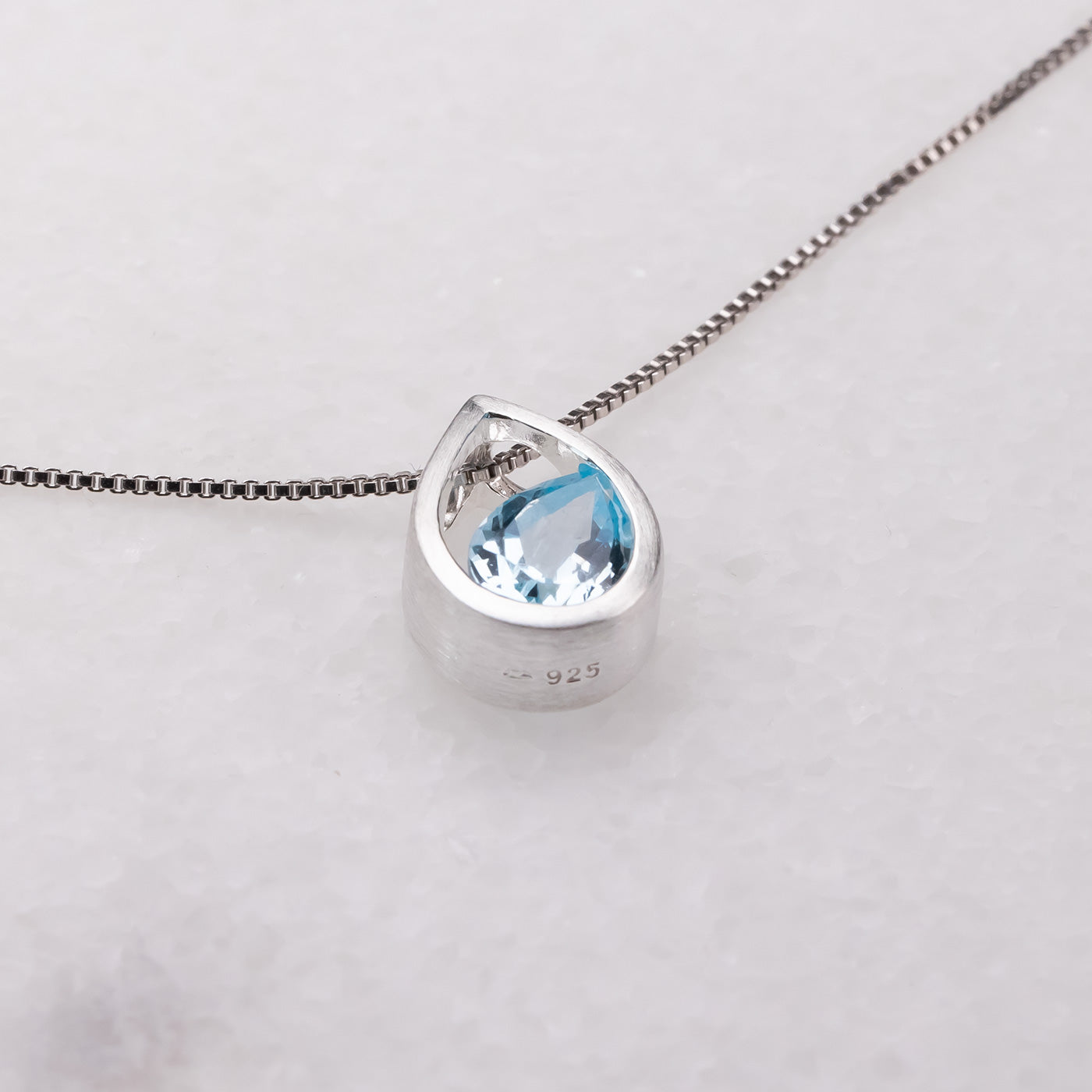 Silver Droplet Pendant With Blue Topaz