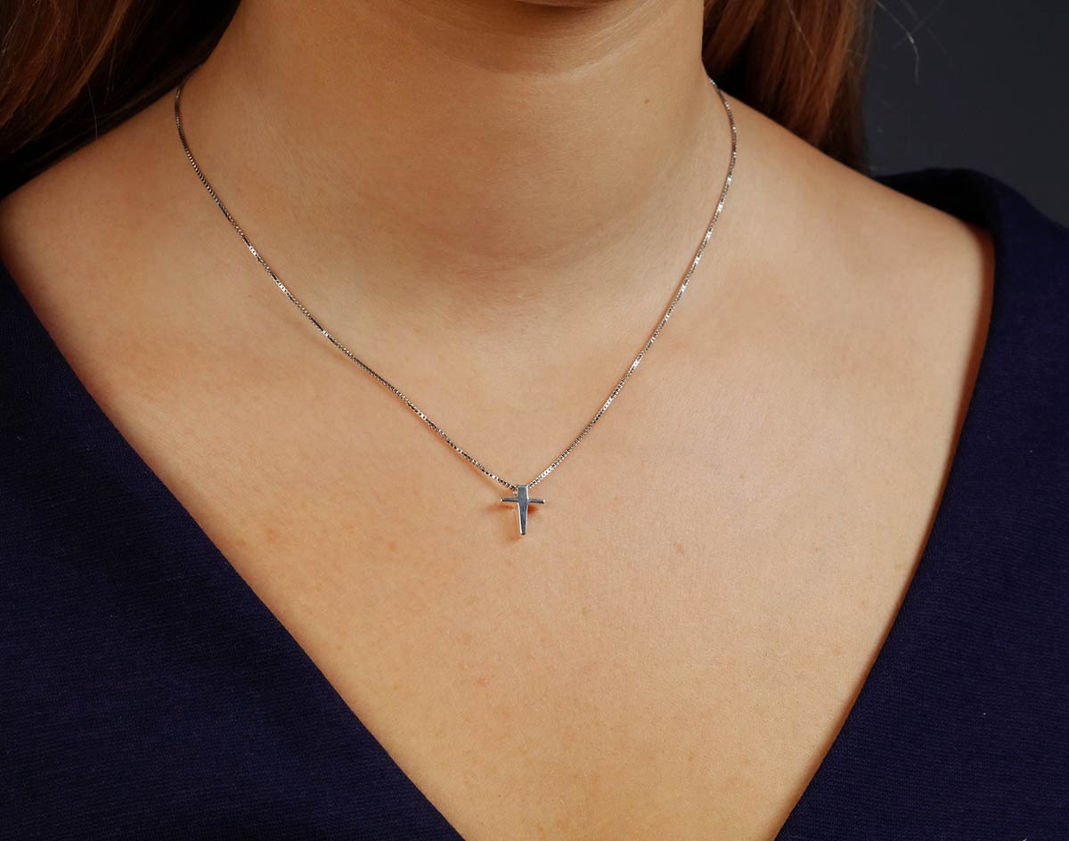 Small diamond cross on sale pendant