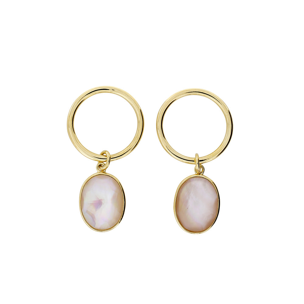 Gold vermeil hoop earrings featuring oval mother of pearl drops with a smooth, polished finish, combining sculptural elegance with a contemporary design.