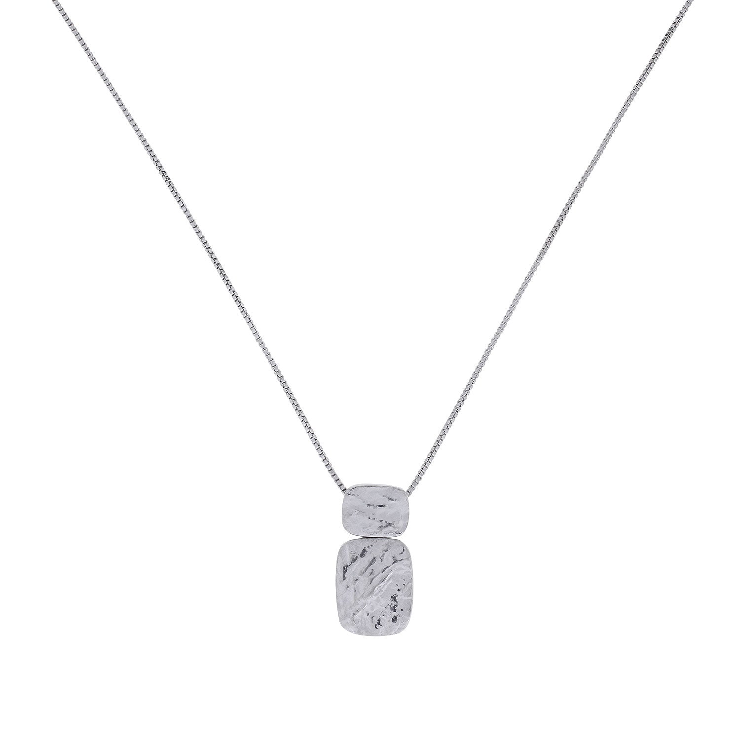 Contemporary sterling silver pendant featuring two textured rectangular shapes arranged vertically on a fine chain, exemplifying sculptural elegance in silver jewellery.