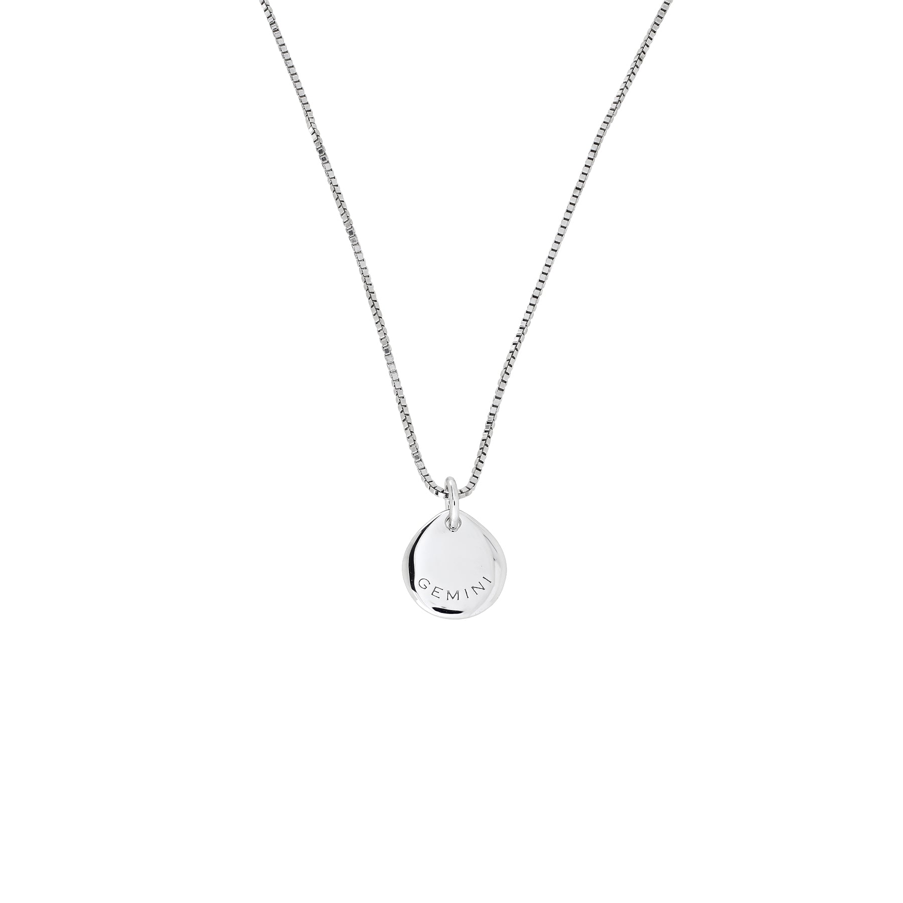 Delicate sterling silver pendant engraved with "GEMINI" suspended from a fine chain, showcasing a minimalist and sculptural design by Azendi.