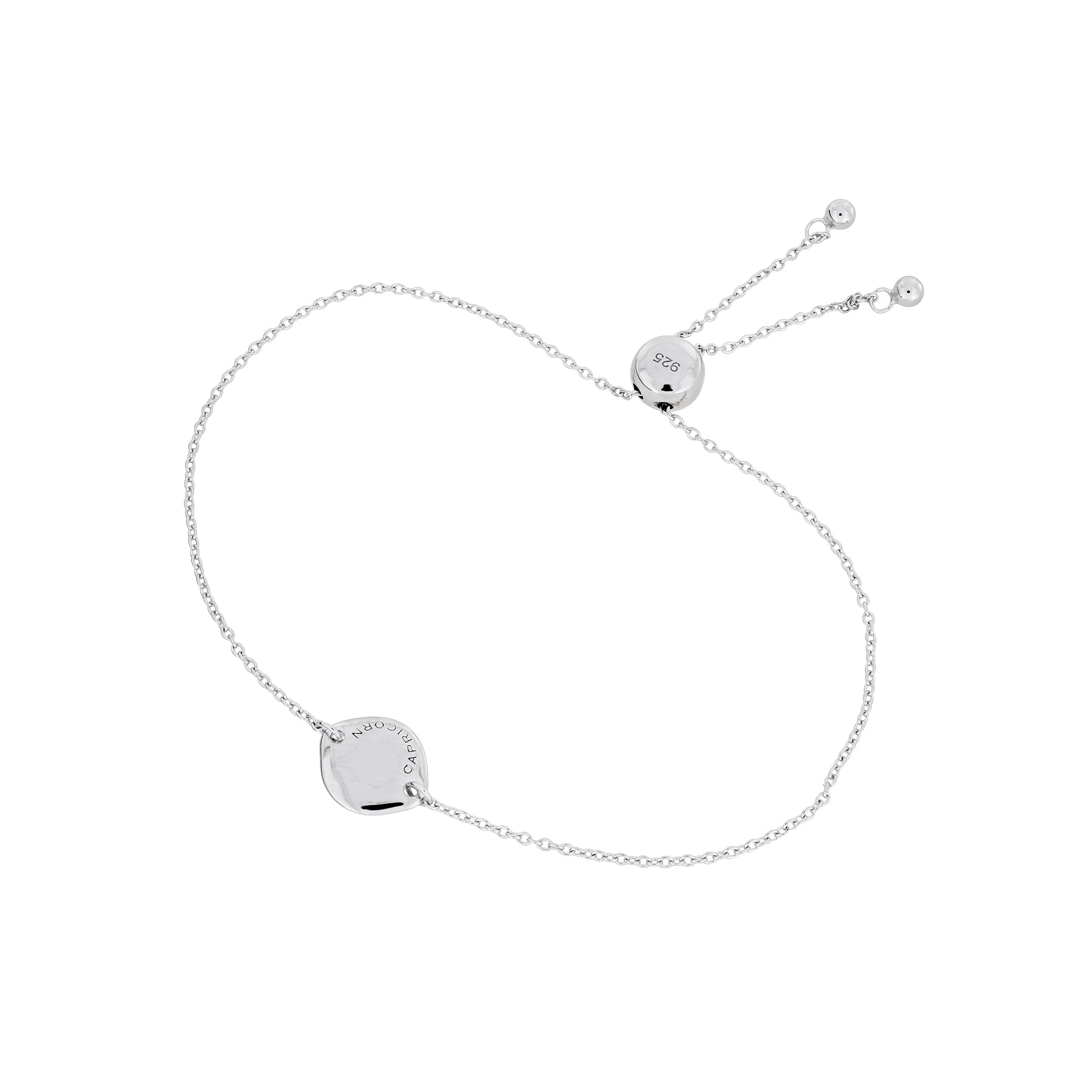 Delicate sterling silver adjustable bracelet featuring a smooth Capricorn zodiac charm, finished with a sliding bead for customizable sizing and polished shine.