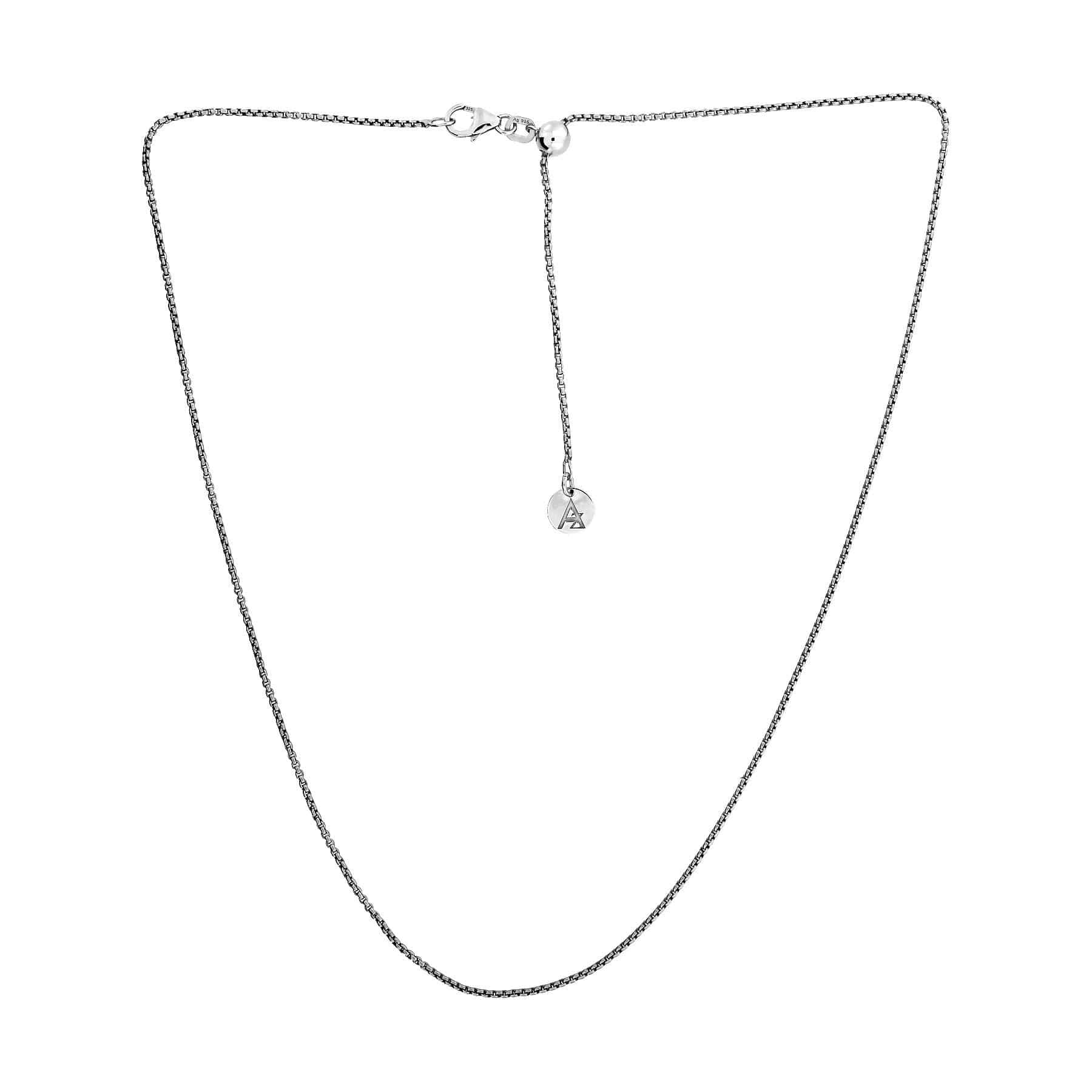 Delicate sterling silver rollo chain featuring a sliding adjuster and a small circular charm, presented against a clean white background.